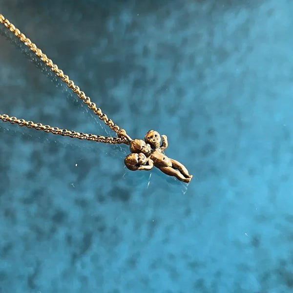 Three Headed Baby Necklace